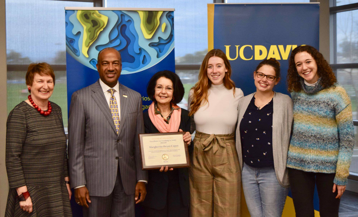 Margherita Heyer-Cᰵt with Chancellor Gary S. May, Vice Provost and Associate Chancellor Johanna Reglulska ,and three nominating students, from left to right, Catherine Charles, Taylor Morgan and Beatrice Paolucci, at the Excellence in the Teaching of Study Abroad Award ceremony, UC Davis International Center, March 7, 2019
