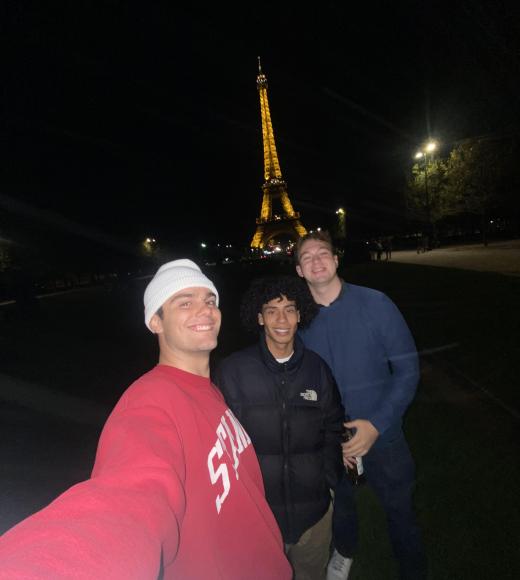 Rémi in front of the Eiffel Tower with friends Daniel Ramirez Minaya and Marshall Kagan.
