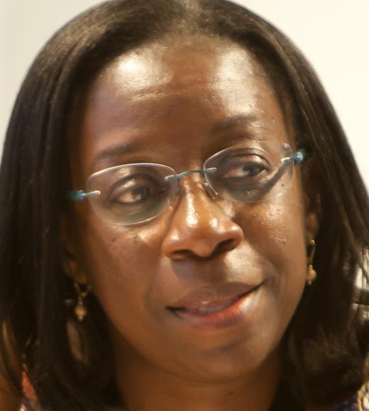 Woman in glasses looking off to the side