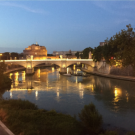 A sunset photo of a bridge in Italy