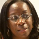 Woman in glasses looking off to the side